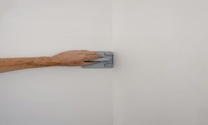 Ensure every wall is perfectly smooth before painting by repairing cracks and sanding surfaces — the key to a flawless, professional look.